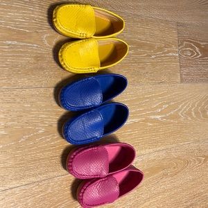 Lot of adorable Mocs for toddler girl in fuscia, royal blue, and yellow..size 27